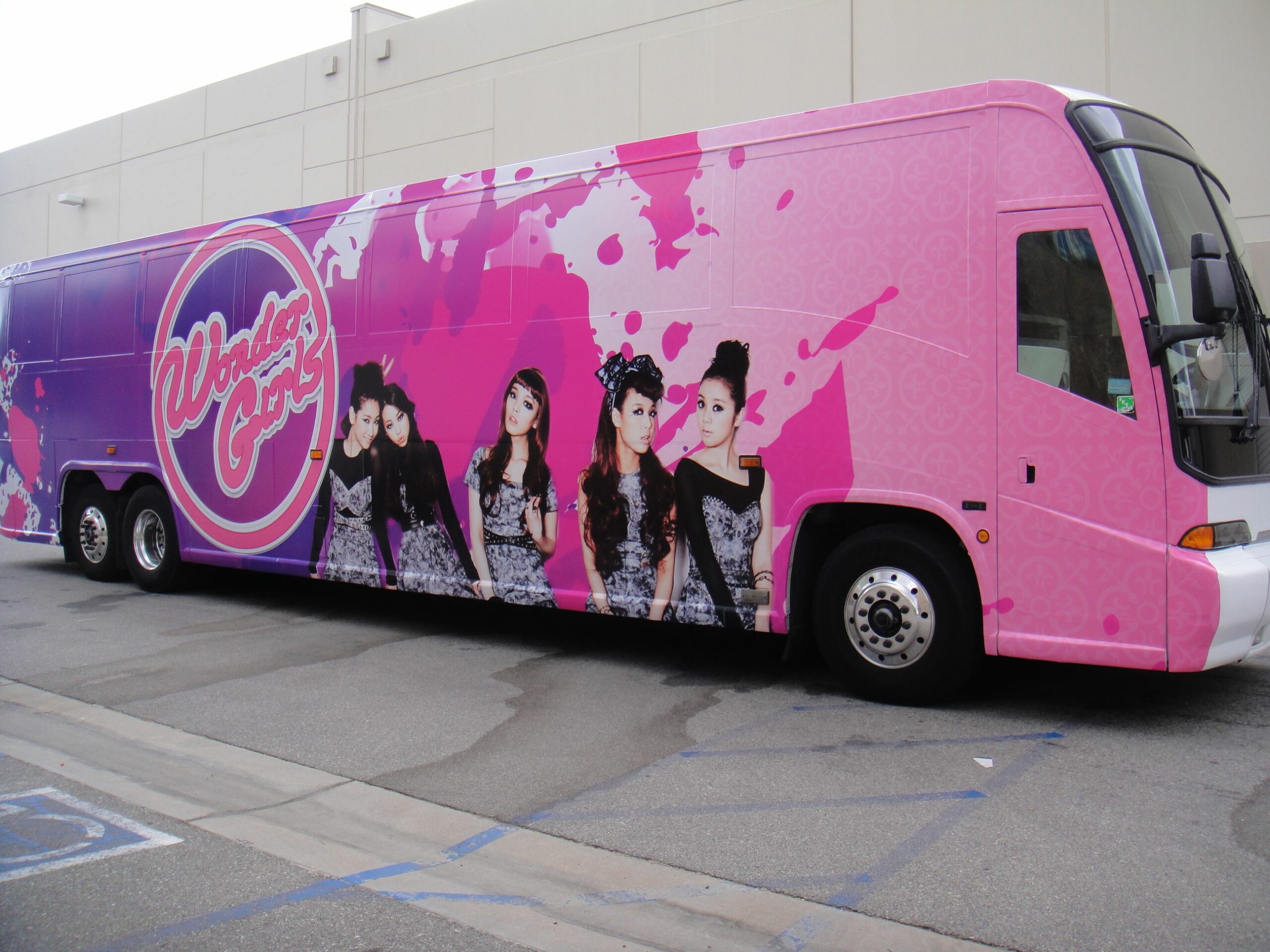 who has a pink tour bus