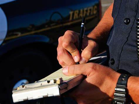 Male police officer issuing a ticket