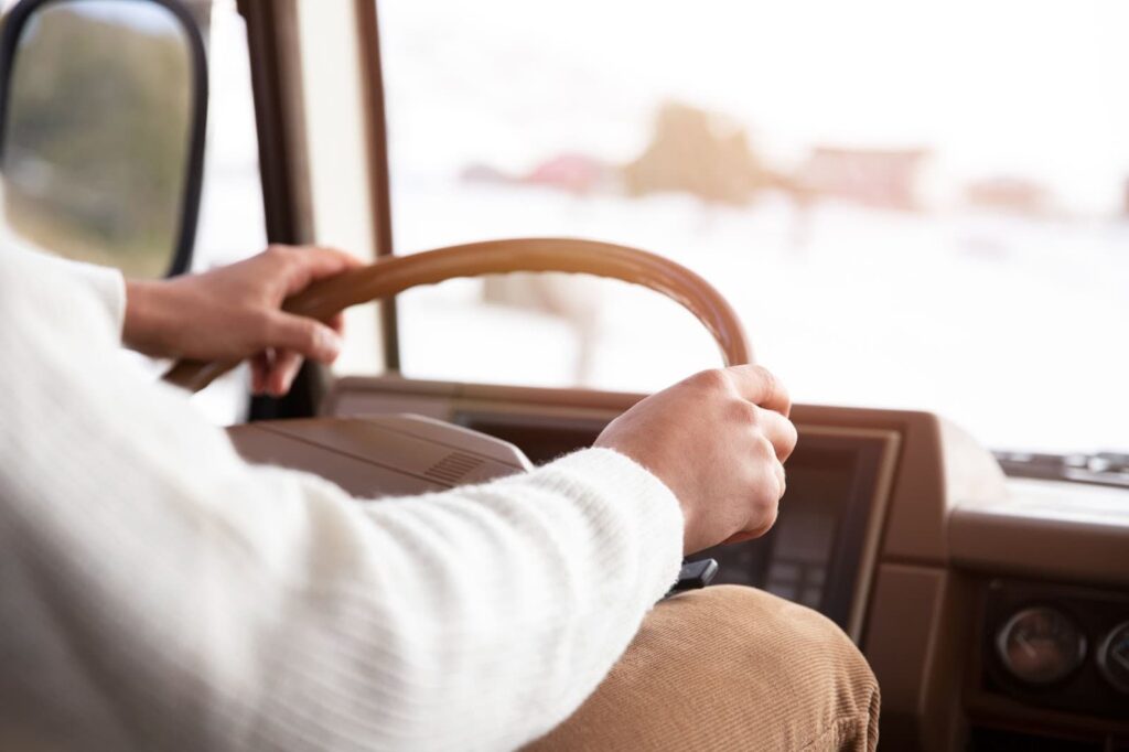 Close up of hands holding wheel